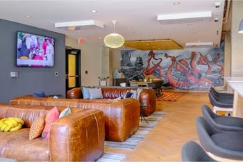 Expansive club room with fireplace, pool tables, full kitchen